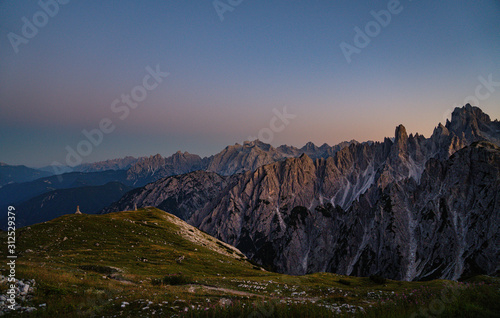 Fototapeta Naklejka Na Ścianę i Meble -  Panoramic view of famous Dolomites mountain peaks glowing in beautiful golden evening light at sunset in summer, South Tyrol, Italy