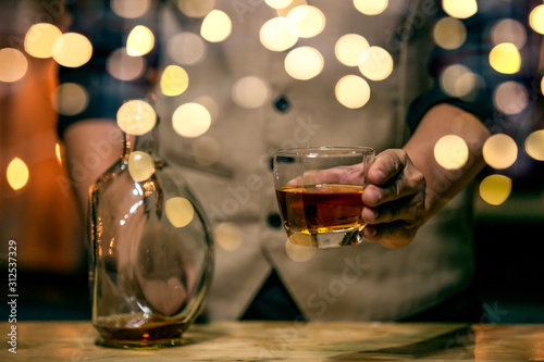 Barman pouring whiskey whiskey glass beautiful night