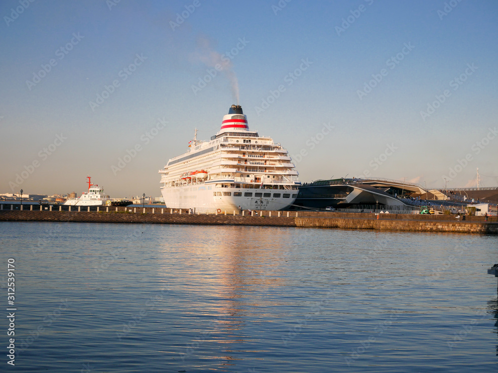 The white cruise ship docked in Yokohama Japan