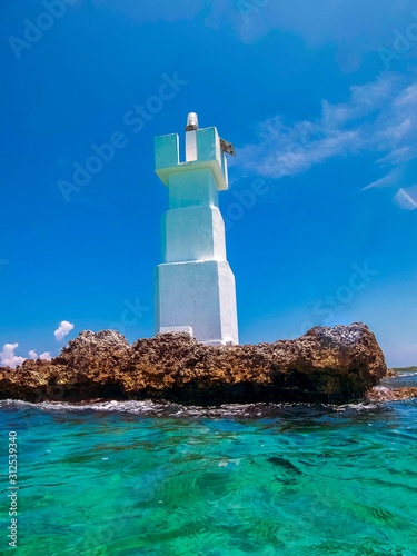 El Farito lighthouse on Isla Mujeres near Cancun, Mexico photo