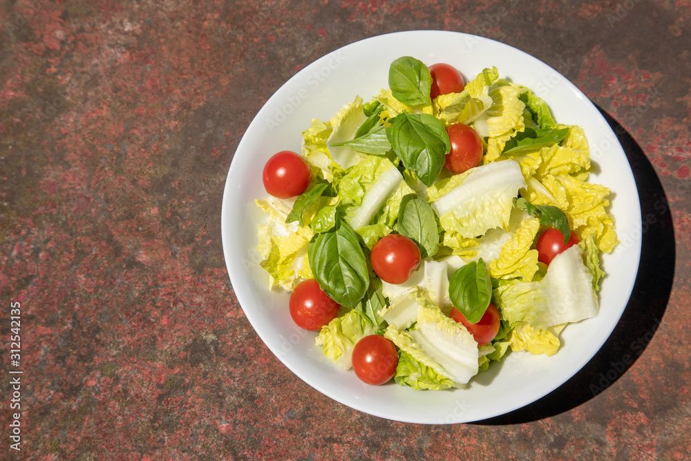 Healthy vegetarian vegan lunch dinner salad bowl  tomato, green vegetable vegetables Top View From Above on a rusty metallic table background