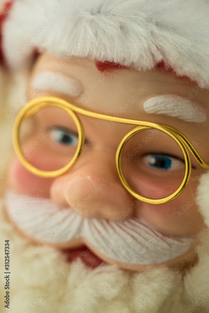 Portrait Santa Claus face in glasses and hat, closeup toy. Portrait Santa Claus face in glasses and hat, closeup toy.