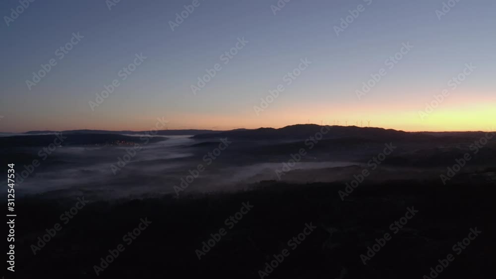 Aerial view of mist on the mountains during the sunrise. Amazing view and beautiful colors. Aerial view of mist on the mountains during the sunrise. Amazing view and beautiful colors.