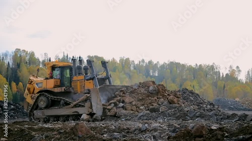  panorama Yellow tracked bulldozer moves your bucket stones
