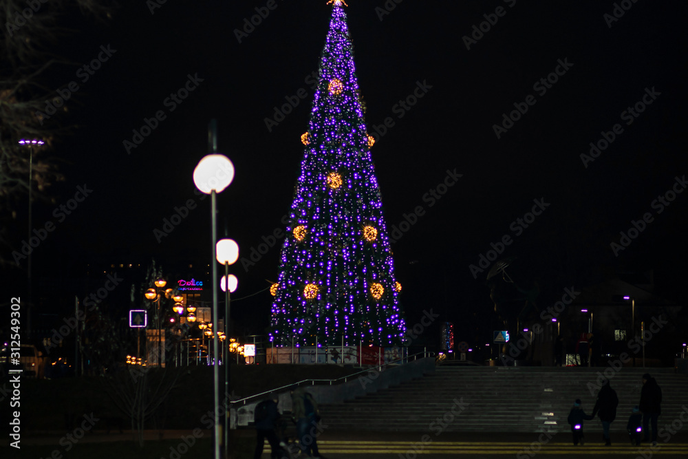 Scenery in the form of a luminous Christmas tree in the park