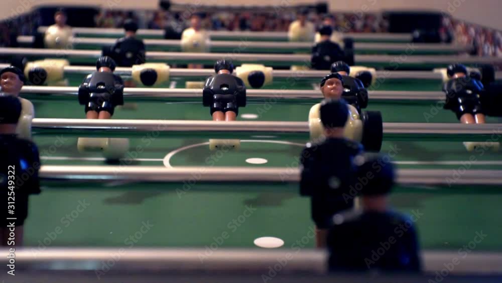 foosball.small plastic players in the table soccer.game kicker close up.Shallow depth of field. foosball.small plastic players in the table soccer.game kicker close up.Shallow depth of field.