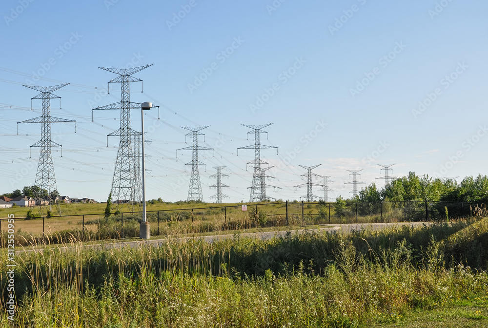 Electricity pylons in the field Electricity pylons in the field