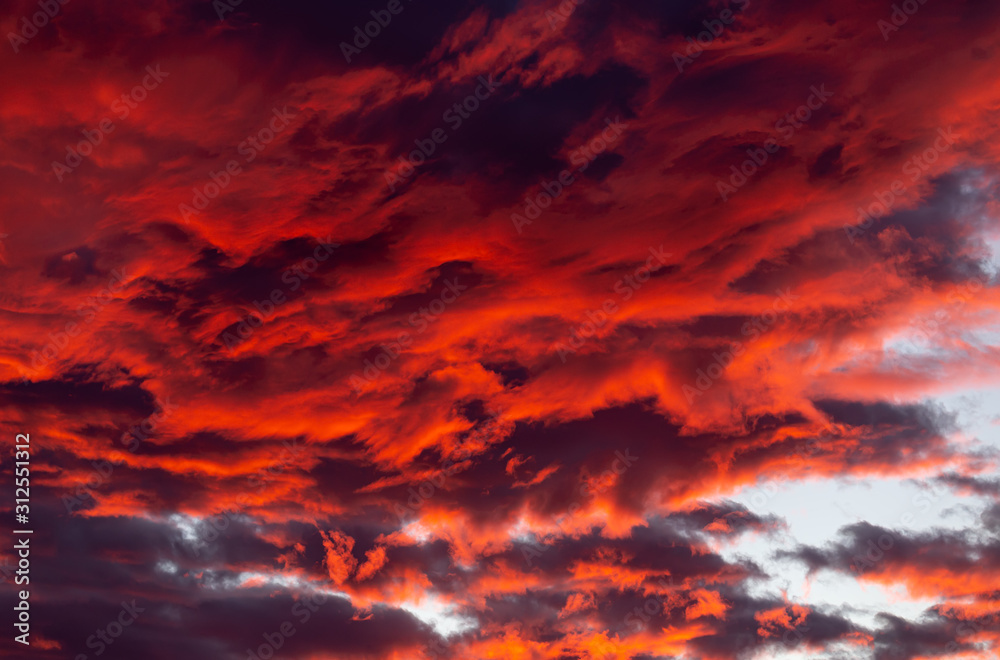 Dramatic red clouds - beautiful colorful sunset Dramatic red clouds - beautiful colorful sunset