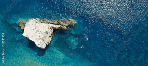 Aerial drone ultra wide photo of iconic Cycladic turquoise seascape in island of Milos, Cyclades, Greece