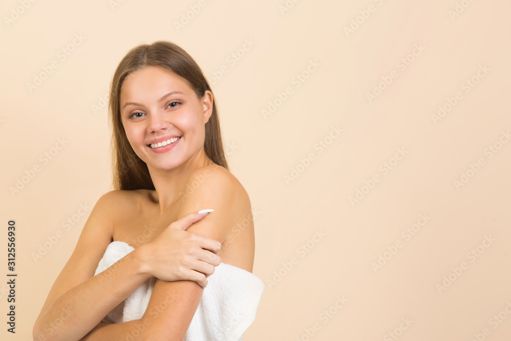 beautiful young woman on a beige background with long flowing hair beautiful young woman on a beige background with long flowing hair