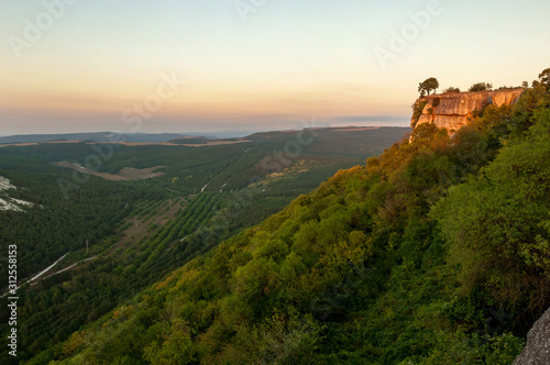 Sunset over Crimean mountains from Chufut Kale plateau near Bakhchisaray, Crimea