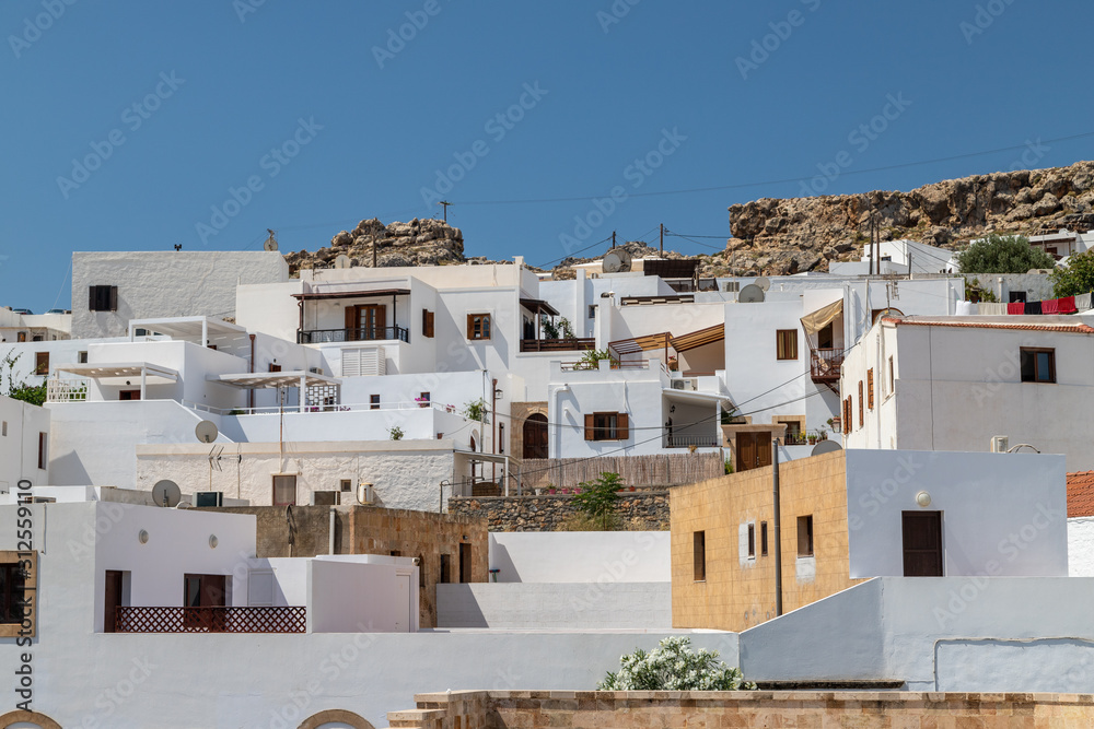 View at the city of Lindos on Greek island Rhodes with white houses