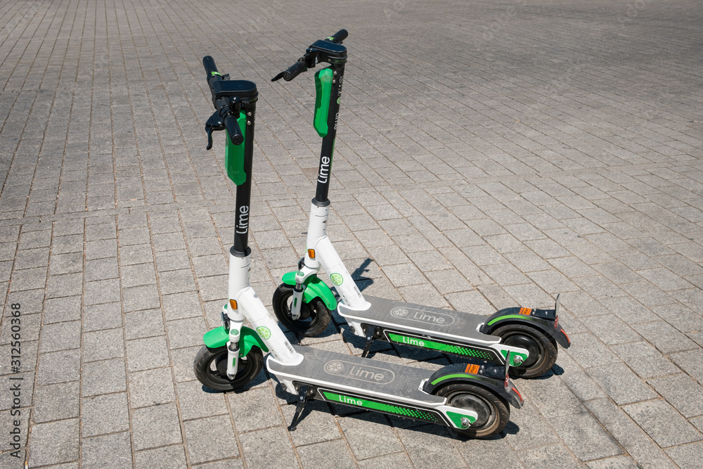 Shetland isolation Instruere Electric scooter , escooter or e-scooter of the ride sharing company LIME  on sidewalk - Berlin, Germany - june 2019 Stock Photo | Adobe Stock