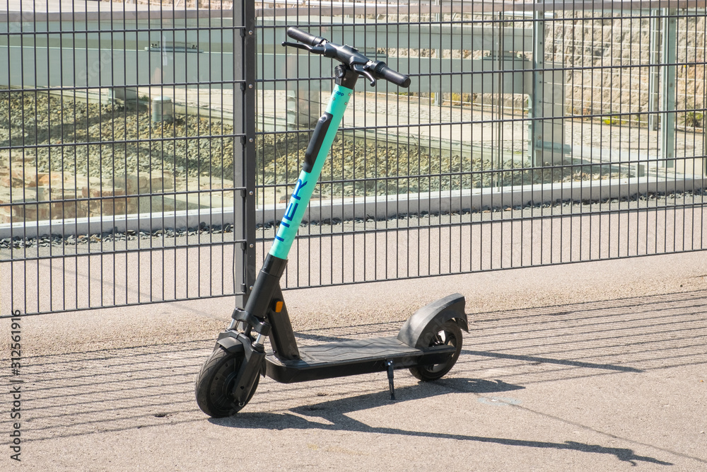 scooter , escooter or e-scooter of the ride sharing company TIER on sidewalk in - Berlin, - june 2019 Stock Photo | Adobe Stock