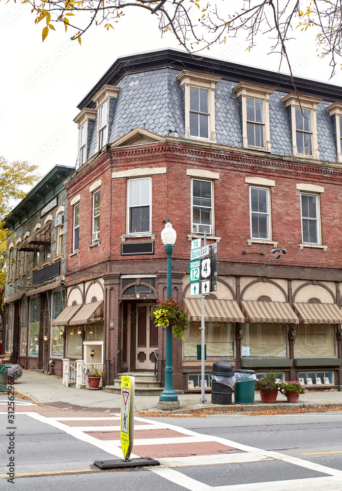 Fototapeta premium Small shops and restaurants on a cool Fall day in the historic New England town of Woodstock, Vermont