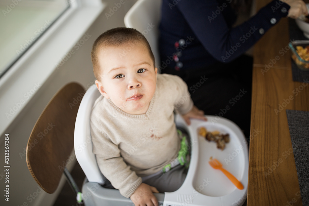 Toddler Boy Eating Dinner At Home Toddler Boy Eating Dinner At Home