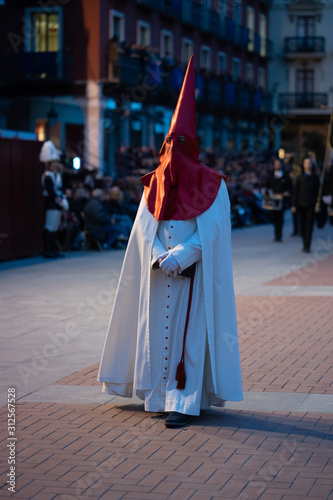 Christian Prayer With Traditional Costume At Night.