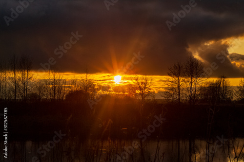 bright sunset over the river, selective focus with shallow depth of field, warm filter