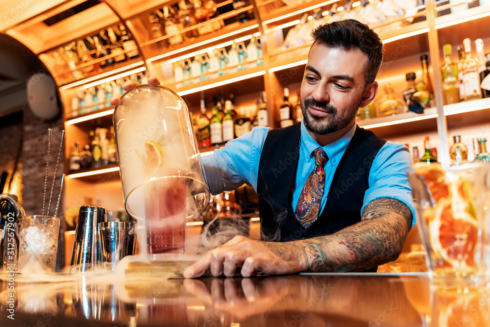 Professional young bartender working