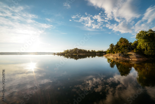 Calm water surface of lake in evening