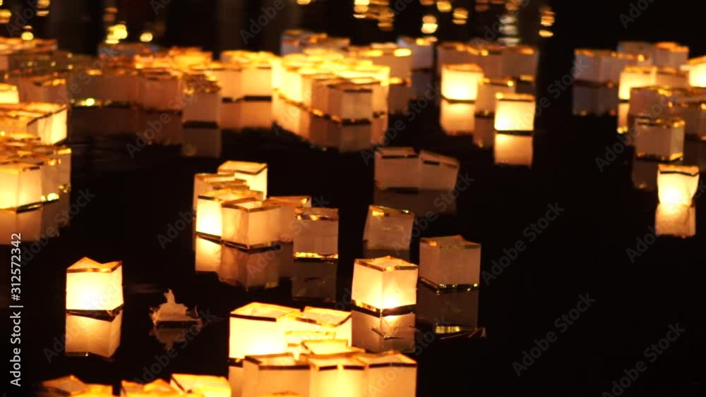 paper water lanterns floating on lake during Chinese New Year, Diwali lantern festival. Wish lampions with candles . paper water lanterns floating on lake during Chinese New Year, Diwali lantern festival. Wish lampions with candles .