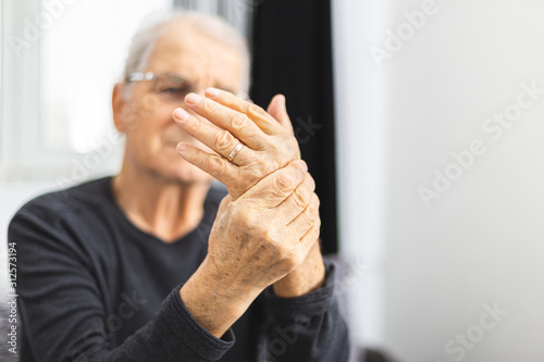 Elderly Person With Painful Hand . Old man have a problem with circulation hands