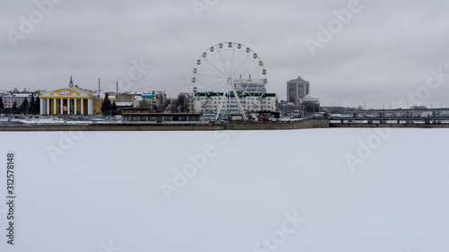 Cheboksary. Ferris wheel and the building of the drama theater on the shore of the Cheboksary Bay