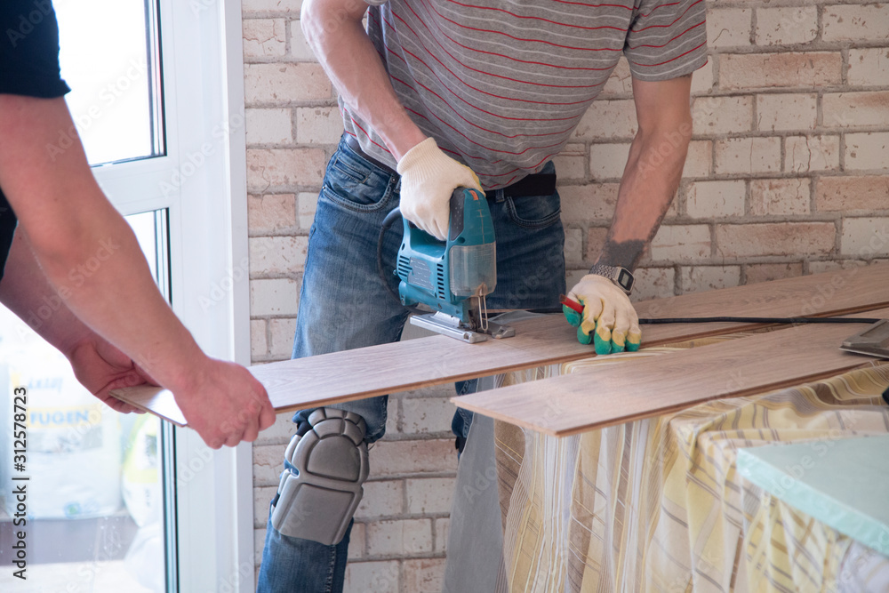 Laminated floor.Installing laminate on the floor. Laminated floor.Installing laminate on the floor.