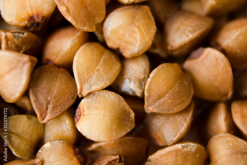 buckwheat on a wooden natural background macro shot from above buckwheat on a wooden natural background macro shot from above