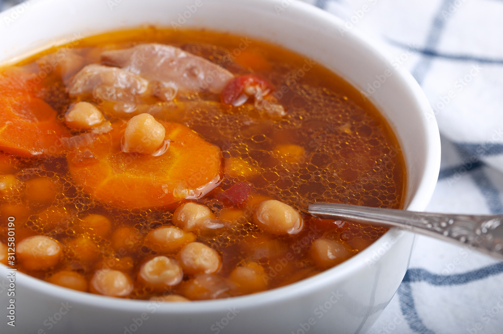 Soup with chicken, peas, tomato and sliced carrots. Tasty hot soup. Soup with chicken, peas, tomato and sliced carrots. Tasty hot soup.