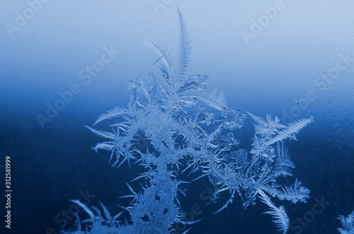 Color of the year 2020 classic blue. Macro of ice on frozen window close up