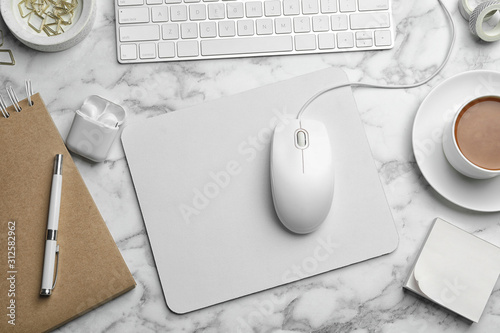 Принти на полотні Modern workplace with mouse and keyboard on marble table, flat lay