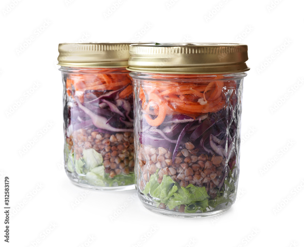 Glass jars with healthy meal isolated on white Glass jars with healthy meal isolated on white