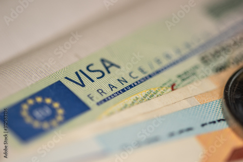 Schengen visa in the passport. Issued by the French Embassy. This sample of the Schengen visa has been put into circulation since 2019. Selective focus.