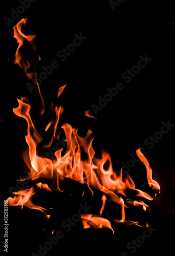 Flames of fire on a black background. The mystery of fire.