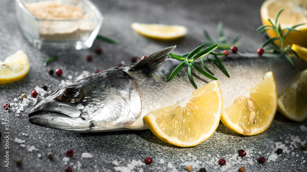 .raw fish with lemons on a blue background