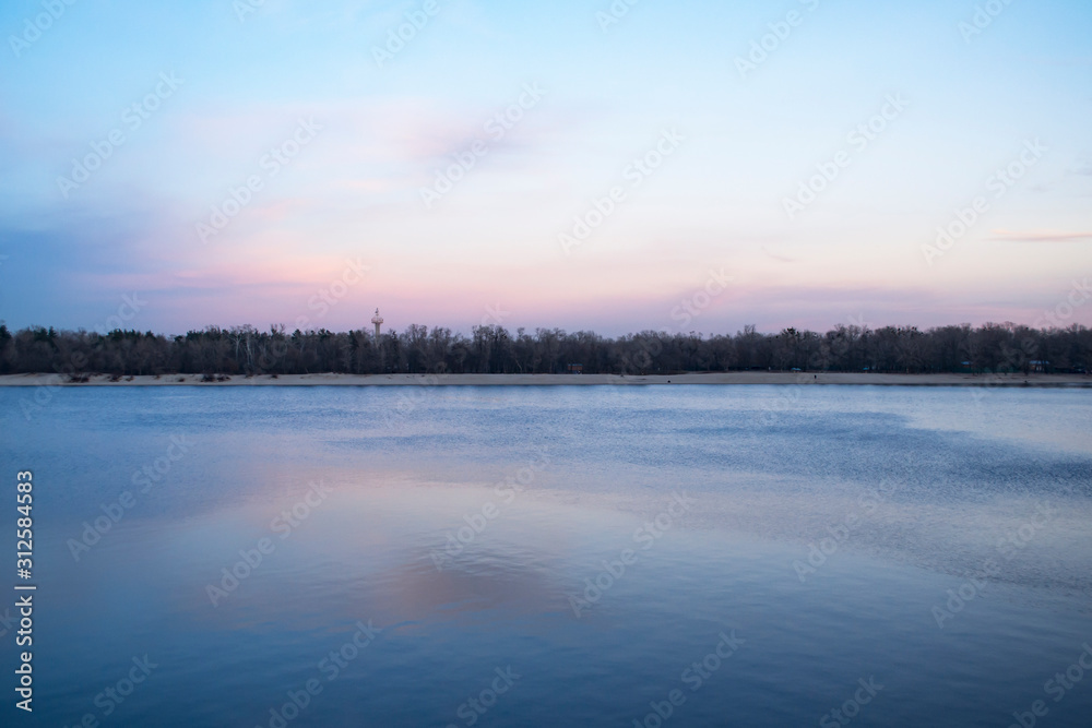 Sunset over the lake at winter.