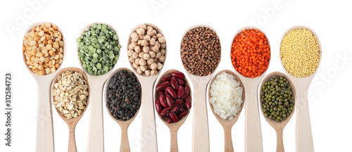 Different types of legumes and cereals on white background, top view. Organic grains photo