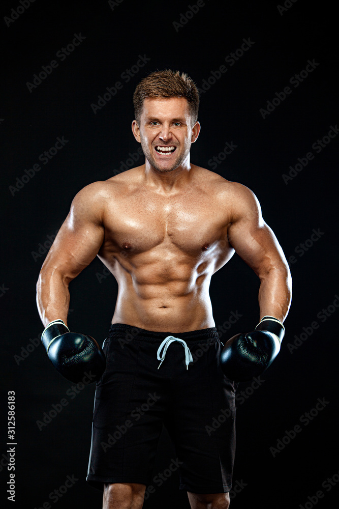 Fitness and boxing concept. Boxer, man fighting or posing in gloves on dark background. Individual sports recreation. Fitness and boxing concept. Boxer, man fighting or posing in gloves on dark background. Individual sports recreation.