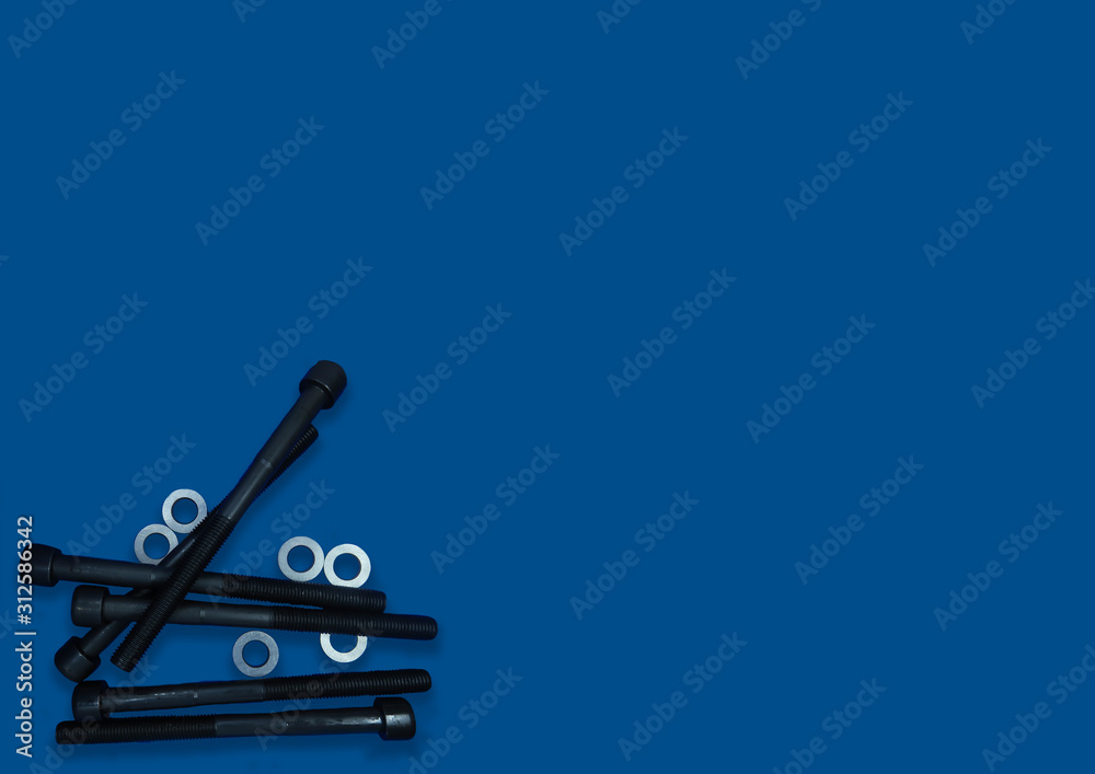 two screw bolts on the classic blue background, long bolts, technic, repair, copyspace two screw bolts on the classic blue background, long bolts, technic, repair, copyspace