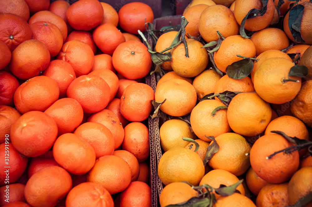Organic clementines and oranges for sale in a small market