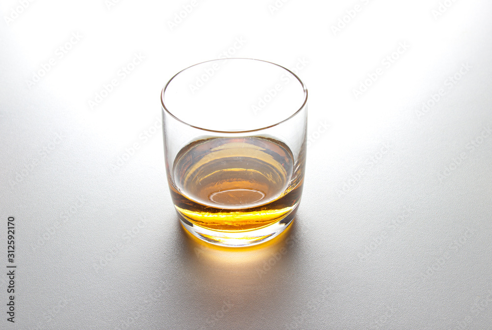 glass of whiskey on white background. glass of whiskey on white background.