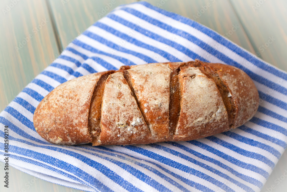 French bread roll with crisp crust. Organic homemade country small bread