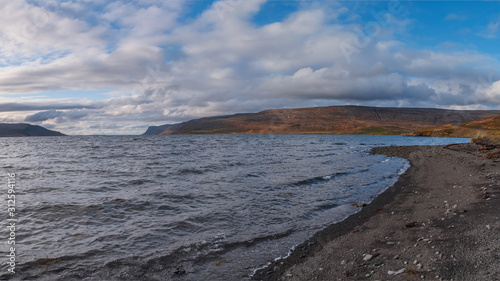 Blue sea water at a beach at Patreksfjordur at the west fjords of Iceland. September 2019