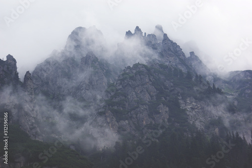 Dark mountains in the fog and clouds