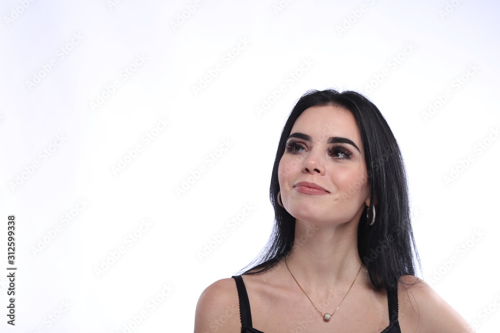 Beautiful young brunette woman in black dress on white background Beautiful young brunette woman in black dress on white background