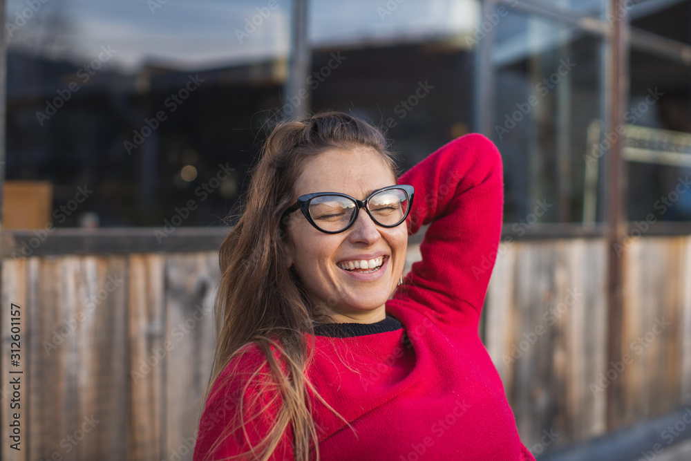 young woman enjoying winter day outdoors young woman enjoying winter day outdoors