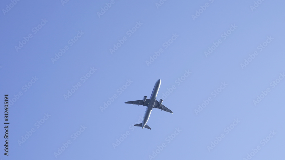 plane in clear blue sky. flying passenger plane in clear blue. air transport traveling by plane plane in clear blue sky. flying passenger plane in clear blue. air transport traveling by plane