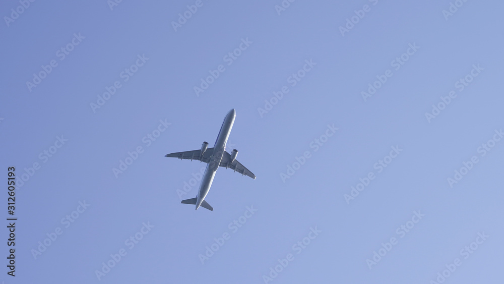 plane in clear blue sky. flying passenger plane in clear blue. air transport traveling by plane plane in clear blue sky. flying passenger plane in clear blue. air transport traveling by plane