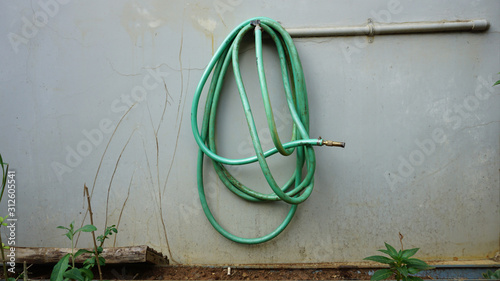 150 Water tap garden hose water meter hanging on the wall